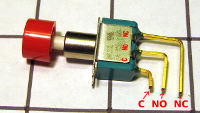 This is a momentary pushbutton with three terminals.  We've made the terminal labels C, NO, and NC more visible.