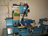 This shows the entire Smithy 1220XL 3-in-1 lathe/mill machine, with the mill head cover removed, set up for milling an aluminum bar.