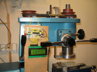 This shows the entire Z-Axis DRO system, with the bottom quill collar and arm, the caliper beam, the top bracket and clamp, plus the electronics breadboard and LCD display.