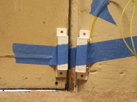 When the door is closed, the magnet and reed switch are in close enough proximity to disable the system.