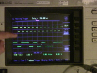 This oscilloscope shot shows two signals coming from the keyboard for the letter F: the clock line in yellow (top), and the data line in green (bottom).  Data is sampled at each falling clock edge.