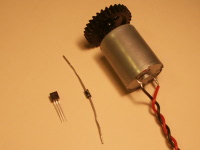 2N7000 n-channel MOSFET, 1N4003 diode, and brushed DC motor