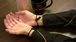 The sensors attached to the wearers wrists with elastic hair bands.